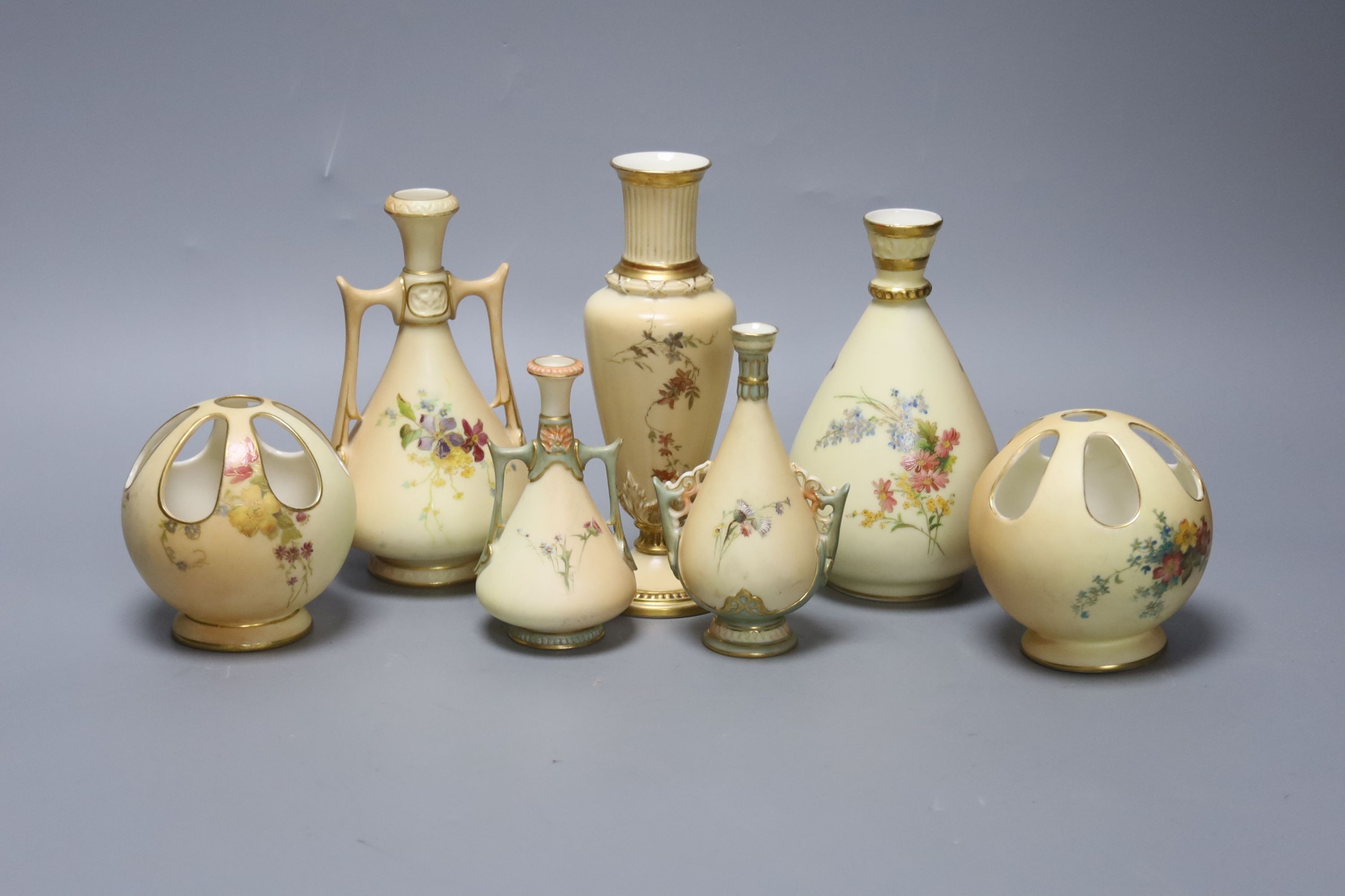 A small group of Royal Worcester blush ivory - a pair of globe pot pourri, a pair small vases and three vases, 17cm